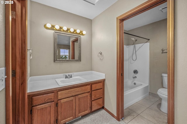 full bathroom with tile patterned flooring, bathtub / shower combination, vanity, and toilet