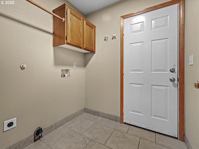 laundry room with light tile patterned floors, hookup for a washing machine, hookup for an electric dryer, baseboards, and cabinet space
