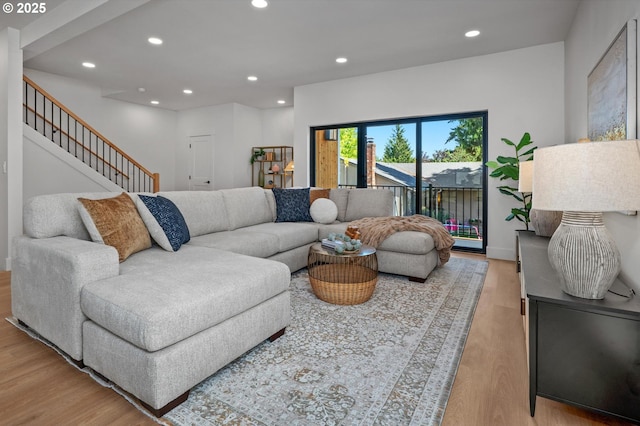 10729 NE Fremont St, Portland, OR 97220 - living area with light wood-type flooring, recessed lighting, stairway, and baseboards