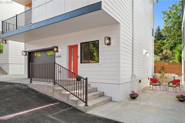 10729 NE Fremont St, Portland, OR 97220 - entrance to property featuring a garage, crawl space, and a balcony