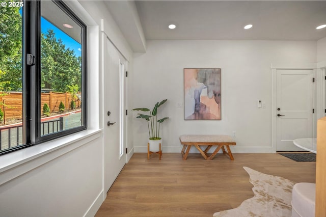 10729 NE Fremont St, Portland, OR 97220 - entrance foyer with light wood-style flooring, baseboards, and recessed lighting