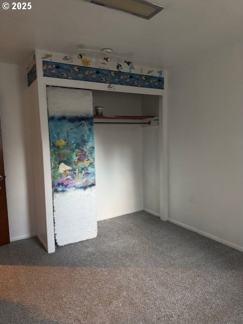 unfurnished bedroom featuring carpet flooring