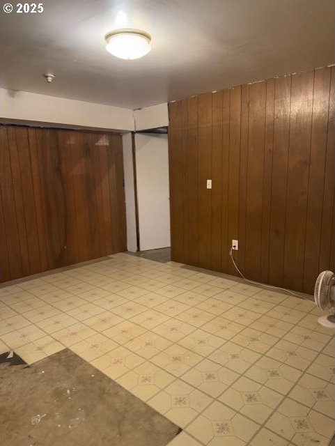 empty room with wooden walls