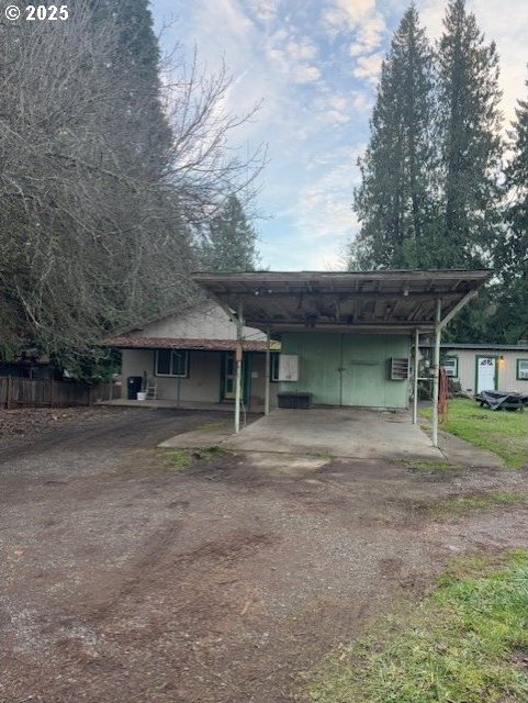 view of front facade with a carport