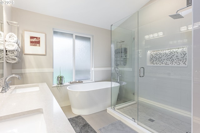 bathroom featuring vanity, tile patterned flooring, and shower with separate bathtub