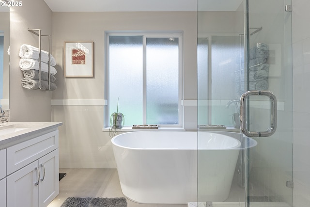 bathroom featuring separate shower and tub, tile patterned flooring, and vanity