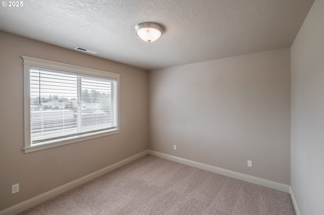 1989 S 12th St, Lebanon, OR 97355 - empty room featuring a textured ceiling and light carpet