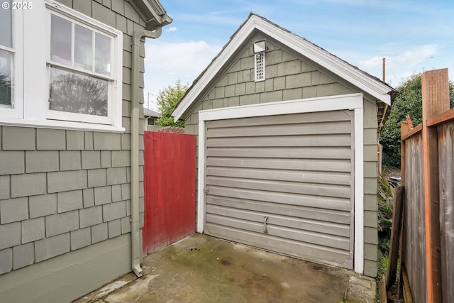 detached garage with fence