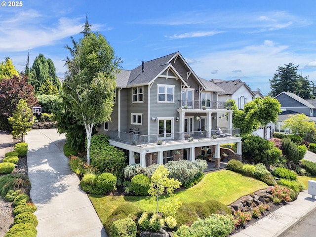 1046 NW Deerfern Loop, Camas, WA 98607 - back of house featuring a balcony and a lawn