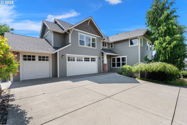 1046 NW Deerfern Loop, Camas, WA 98607 - view of front of home featuring driveway, an attached garage, and roof with shingles