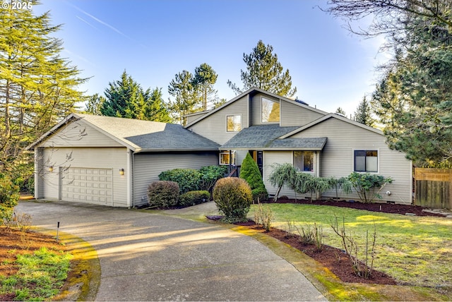 view of front of house featuring a garage and a front yard