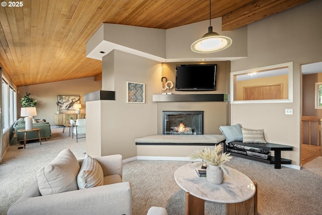 3110 NW Monte Vista Ter, Portland, OR 97210 - carpeted living room with baseboards, a glass covered fireplace, vaulted ceiling, and wooden ceiling