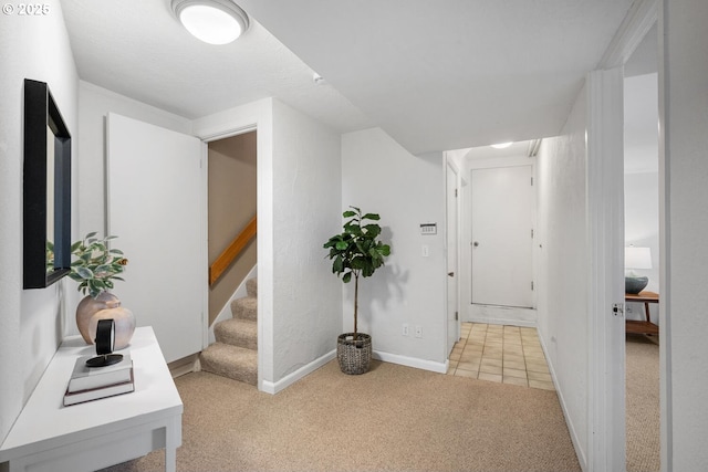3110 NW Monte Vista Ter, Portland, OR 97210 - hallway featuring light colored carpet, baseboards, and stairs