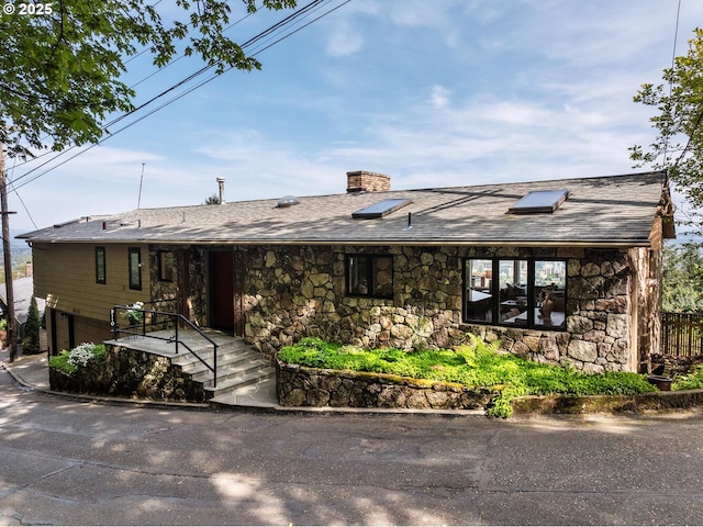3110 NW Monte Vista Ter, Portland, OR 97210 - ranch-style home featuring a chimney, roof with shingles, and stone siding