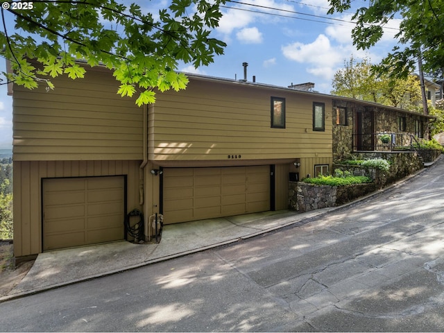 3110 NW Monte Vista Ter, Portland, OR 97210 - view of front of house featuring an attached garage and driveway