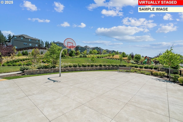 view of patio / terrace featuring a playground and basketball hoop