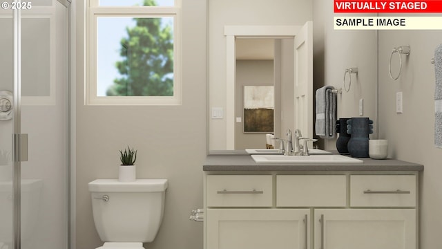 bathroom with vanity and toilet