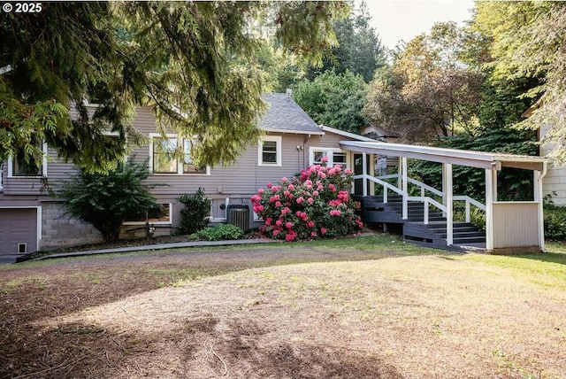 301 W Walnut St, Winlock, WA 98596 - back of property featuring central AC unit and a yard