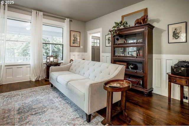 301 W Walnut St, Winlock, WA 98596 - living room featuring a decorative wall, wood finished floors, and a wainscoted wall