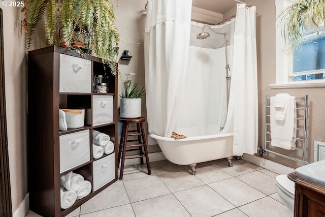 301 W Walnut St, Winlock, WA 98596 - full bathroom with tile patterned flooring, toilet, radiator, a towel warmer, and shower / bath combo