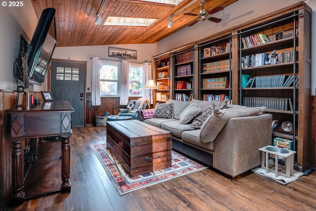 301 W Walnut St, Winlock, WA 98596 - living area with vaulted ceiling, wood-type flooring, a ceiling fan, a skylight, and wooden ceiling