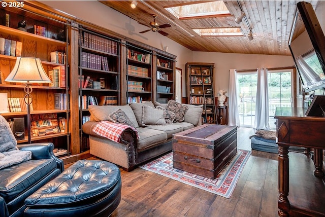 301 W Walnut St, Winlock, WA 98596 - living area featuring wood ceiling, a skylight, hardwood / wood-style floors, a ceiling fan, and vaulted ceiling