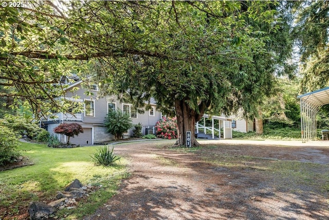 301 W Walnut St, Winlock, WA 98596 - obstructed view of property with a front lawn and dirt driveway