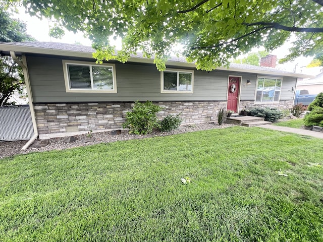 405 1st St, La Grande, OR 97850 - single story home featuring stone siding, a front lawn, and a chimney