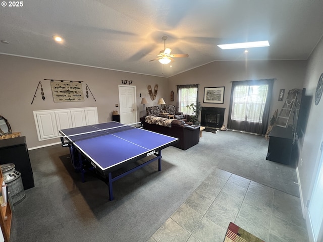 405 1st St, La Grande, OR 97850 - rec room featuring carpet floors, ceiling fan, lofted ceiling, and baseboards