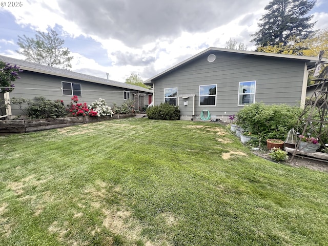 405 1st St, La Grande, OR 97850 - back of house with a lawn