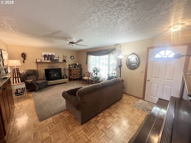 405 1st St, La Grande, OR 97850 - living area featuring ceiling fan, a textured ceiling, and baseboards