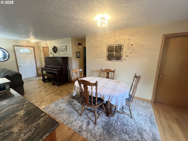405 1st St, La Grande, OR 97850 - dining room featuring a textured ceiling and light wood-style floors