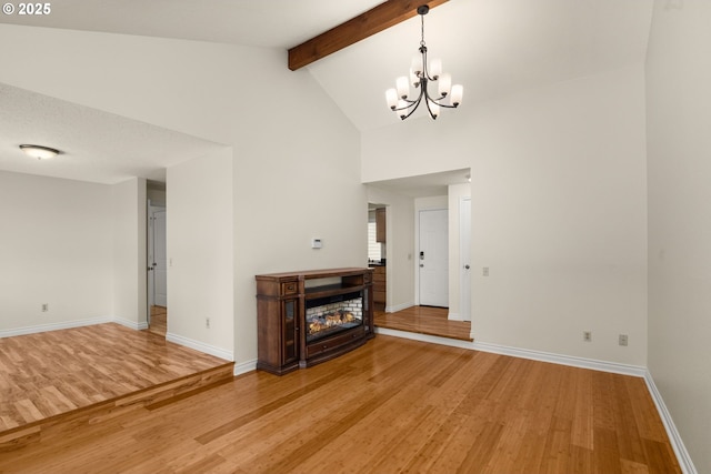 2235 SE Willow Ct, Hillsboro, OR 97123 - unfurnished living room with light wood finished floors, a chandelier, beam ceiling, and high vaulted ceiling
