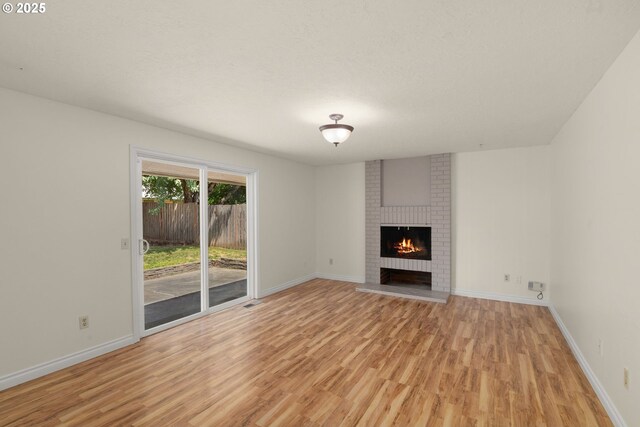 2235 SE Willow Ct, Hillsboro, OR 97123 - unfurnished living room featuring light wood-style flooring, a chandelier, beam ceiling, high vaulted ceiling, and a multi sided fireplace