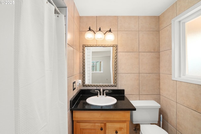 2235 SE Willow Ct, Hillsboro, OR 97123 - bathroom featuring vanity, tile walls, curtained shower, and decorative backsplash