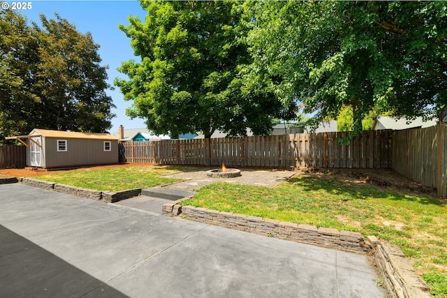 2235 SE Willow Ct, Hillsboro, OR 97123 - fenced backyard with a patio area, a fire pit, and a storage unit
