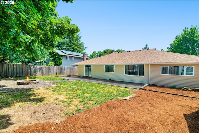 2235 SE Willow Ct, Hillsboro, OR 97123 - back of house featuring a fenced backyard, an outdoor fire pit, and a patio