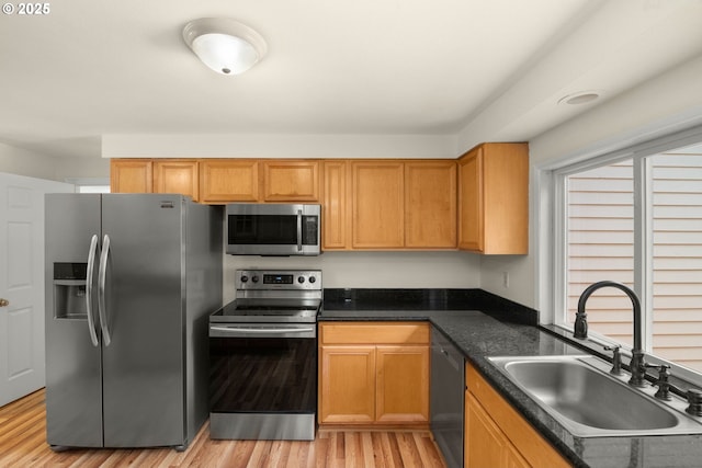 2235 SE Willow Ct, Hillsboro, OR 97123 - kitchen with appliances with stainless steel finishes, dark countertops, and light wood finished floors