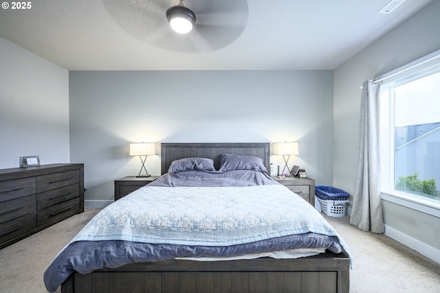 carpeted bedroom with baseboards and ceiling fan