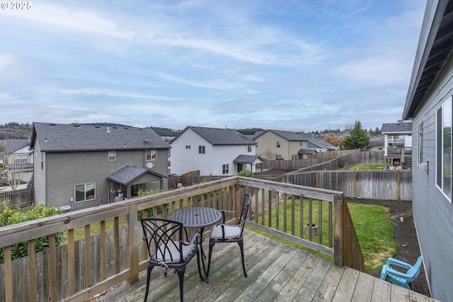 wooden terrace with a residential view