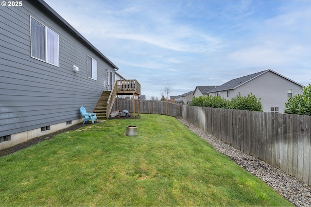 view of yard featuring stairs and a wooden deck