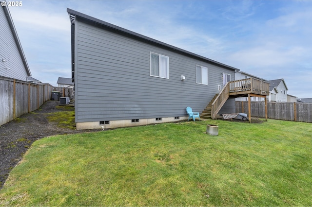 rear view of property with stairway and a deck