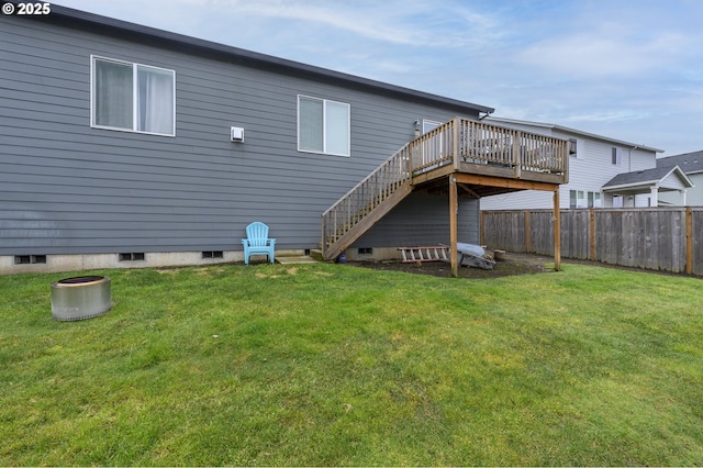 back of property with a wooden deck and stairs