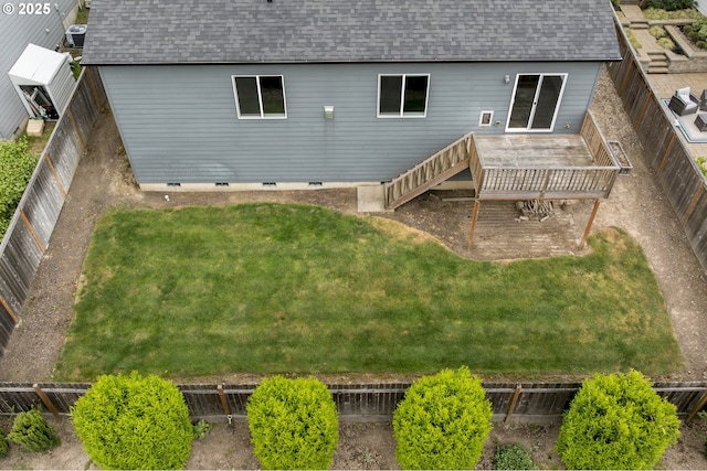 back of house featuring roof with shingles, a wooden deck, and crawl space