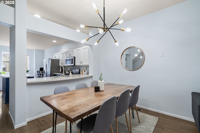 dining room with recessed lighting, baseboards, an inviting chandelier, and dark wood-style floors