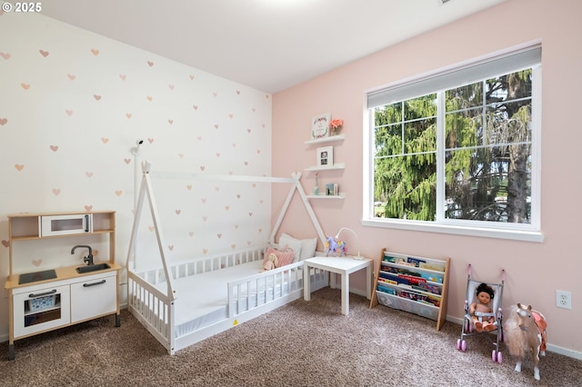 bedroom with carpet flooring, wallpapered walls, and baseboards