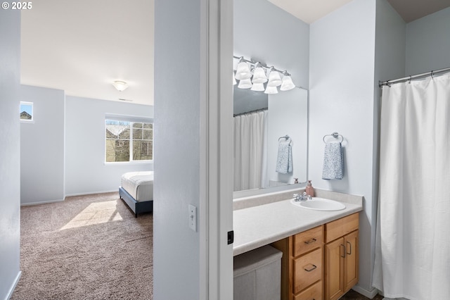 full bathroom with baseboards and vanity