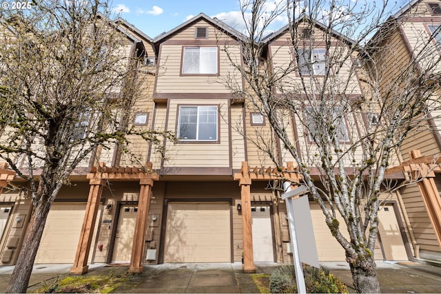 townhome / multi-family property featuring an attached garage