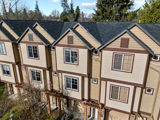 view of front of house with a shingled roof