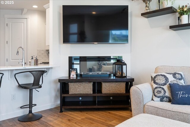 16615 SE Sunshower Pl, Happy Valley, OR 97086 - living area featuring wood finished floors, baseboards, recessed lighting, and a glass covered fireplace